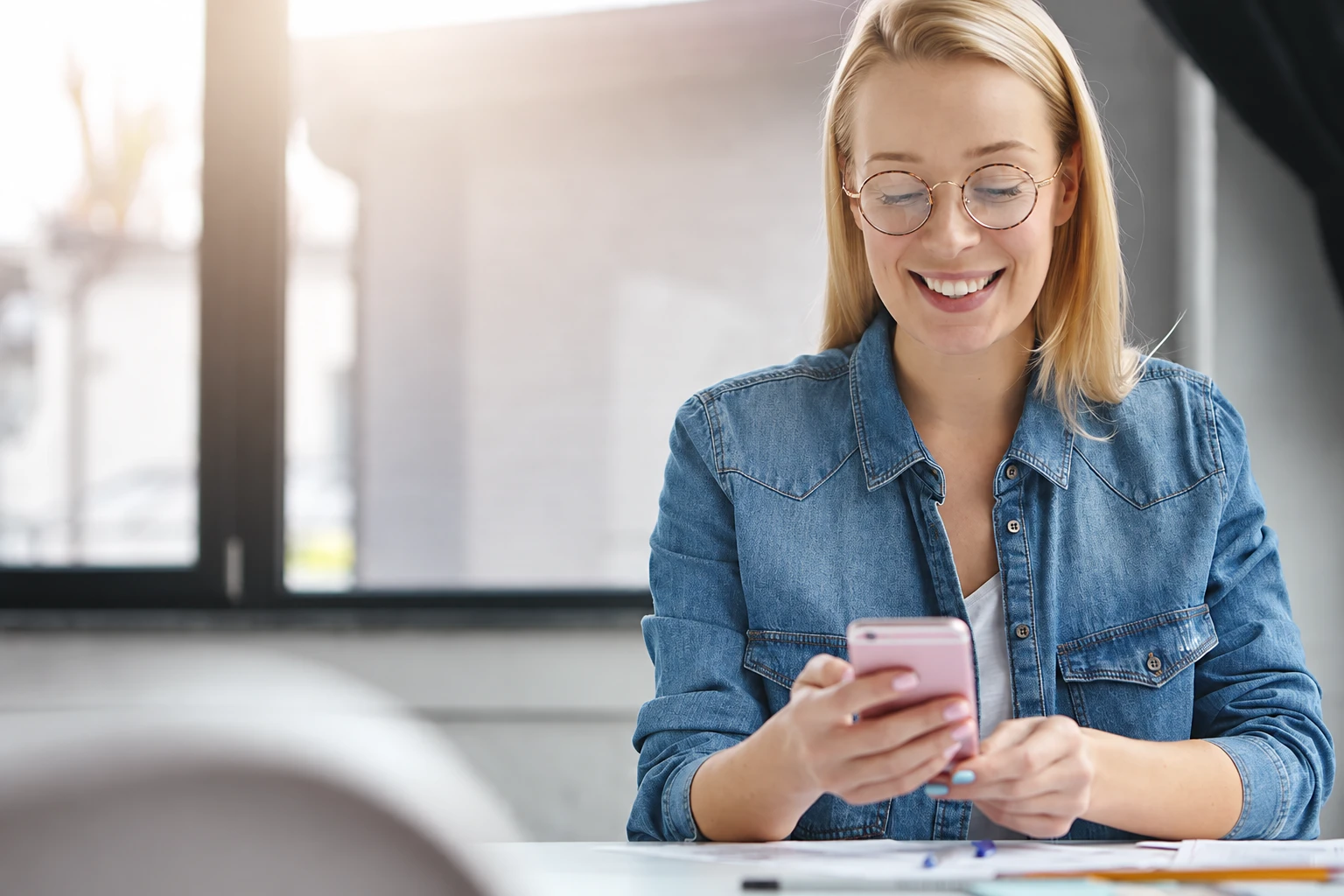 A woman looking at her phone.